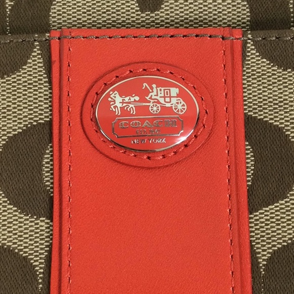Coach logo wristlet accented with a deep orange. - Picture 7 of 7